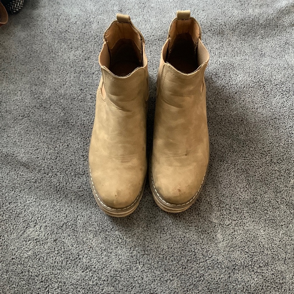 Brown boot have been worn and need a little wash